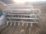 picture  3 of 5 - 24 Stainless steel crates - $300 each. they have not been around hogs for at least 15 years.  They had been feeding bottle calves as that is what the black holder is.